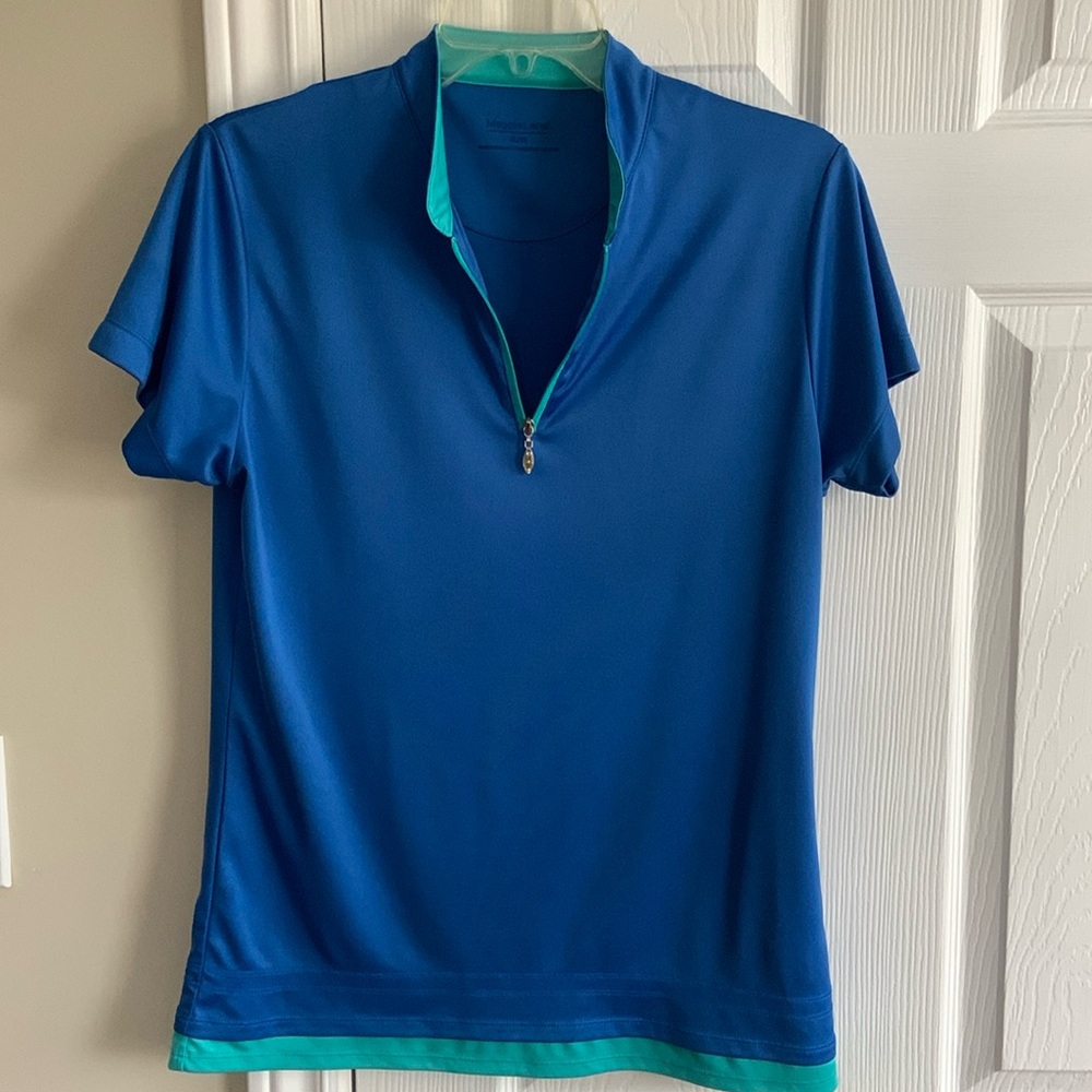 Golf shirt and matching skort. Sold as a set. Like new. No signs of wear